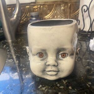 Creepy cute baby head planter
